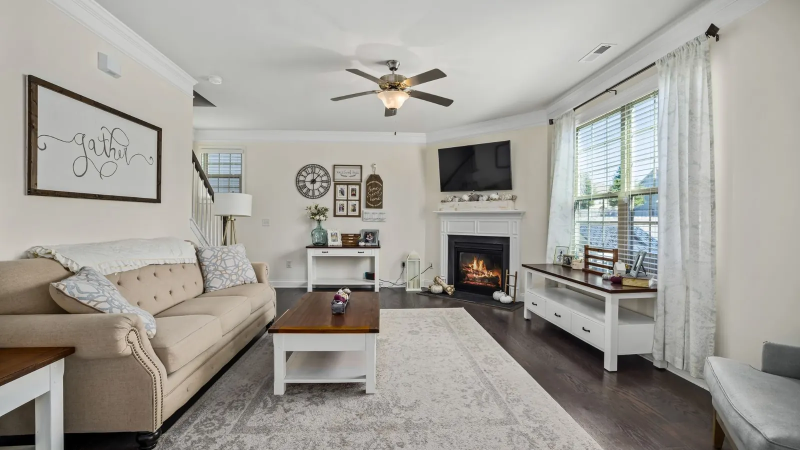Tidy family living room with sofa and fireplace after recurring home cleaning