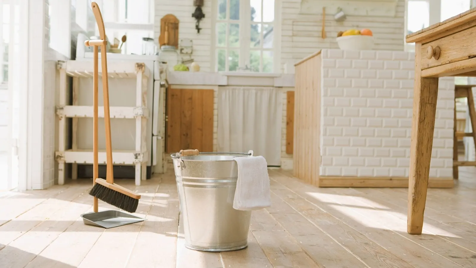 Broom and bucket setup for hardwood floor cleaning