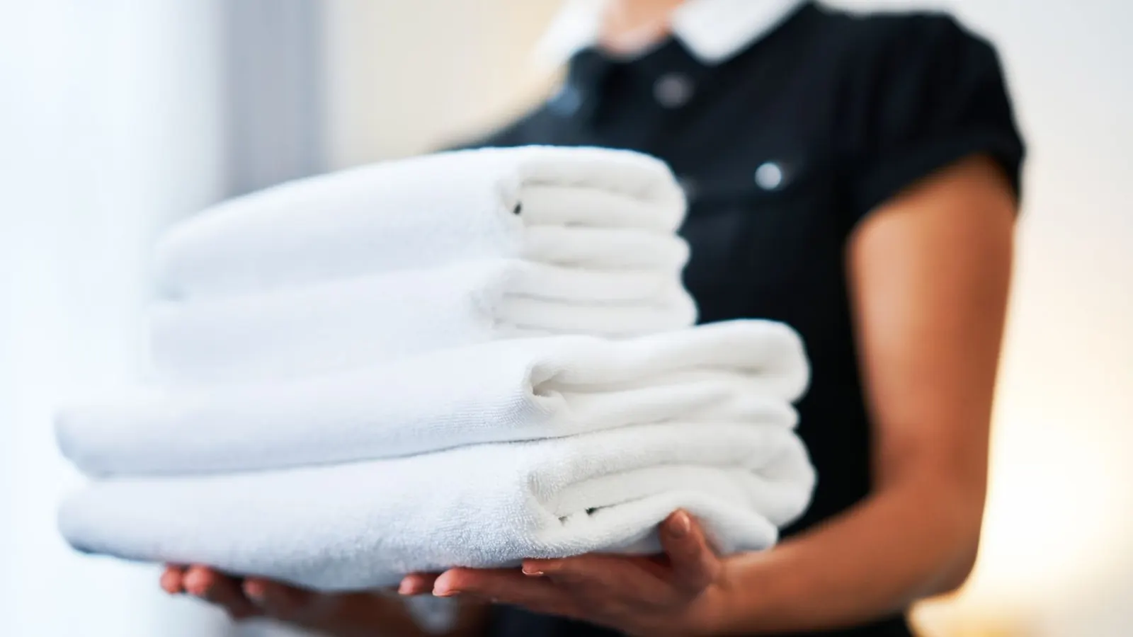 Stacked clean towels prepared for vacation rental guest turnover
